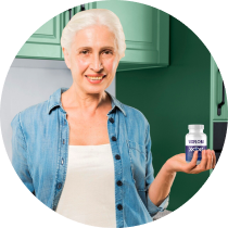 Happy senior customer holding VisiFlora vision support bottle. Real user testimonial for VisiFlora military-inspired eye health supplement.